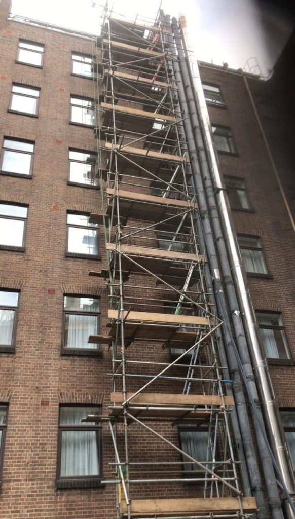 Scaffold tower on brick building
