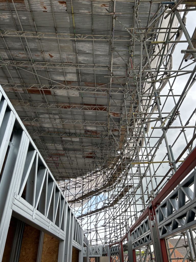 Covered temporary roof structure on site